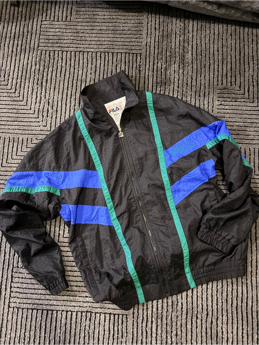 FILA Men’s Black Windbreaker with Blue & Green Stripe Details
